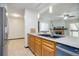 The kitchen features stainless steel appliances, wood cabinets, and a double basin sink at 14590 E 2Nd Ave # B309, Aurora, CO 80011