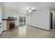 Spacious living room with tiled flooring, fireplace and a sliding glass door to balcony at 14590 E 2Nd Ave # B309, Aurora, CO 80011
