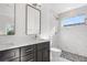 Modern bathroom featuring marble shower and tile flooring, with stylish vanity and hardware at 1308 Snowberry Ln # 303, Louisville, CO 80027
