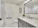 Bathroom with a modern vanity, tiled shower, and contemporary fixtures for a clean, elegant look at 1308 Snowberry Ln # 303, Louisville, CO 80027