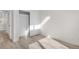 Bright bedroom featuring hardwood floors, closet with sliding doors and modern paint at 1308 Snowberry Ln # 303, Louisville, CO 80027