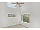 Bright bedroom featuring multiple windows and a ceiling fan providing plenty of light at 1308 Snowberry Ln # 303, Louisville, CO 80027