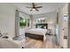 Sunlit bedroom with large windows, and ceiling fan, creating a cozy and inviting atmosphere at 1308 Snowberry Ln # 303, Louisville, CO 80027
