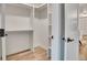 Walk-in closet with shelving and light wood floor at 1308 Snowberry Ln # 303, Louisville, CO 80027