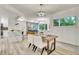 Cozy dining area with modern table setting, leading into the kitchen and featuring natural light at 1308 Snowberry Ln # 303, Louisville, CO 80027