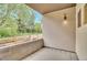 Covered patio with a view of mature trees and greenery at 1308 Snowberry Ln # 303, Louisville, CO 80027