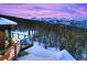 Deck area overlooking mountain views and a snowy landscape at 300 Little Sallie Barber Trl, Breckenridge, CO 80424