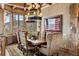 Formal dining room features mountain views, exposed beams and is tastefully decorated at 300 Little Sallie Barber Trl, Breckenridge, CO 80424