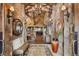 Elegant foyer boasts stone walls, hardwood floors, rustic chandelier, and views to the living room at 300 Little Sallie Barber Trl, Breckenridge, CO 80424
