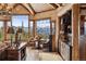 Comfortable sitting area offers mountain views, hardwood floors, and custom wood cabinets with wine storage at 300 Little Sallie Barber Trl, Breckenridge, CO 80424