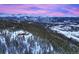 Aerial view of a luxury home nestled in a snowy mountain landscape at 300 Little Sallie Barber Trl, Breckenridge, CO 80424