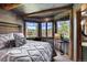 Mountain view bedroom with king-size bed and rustic decor at 300 Little Sallie Barber Trl, Breckenridge, CO 80424