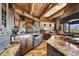 Open kitchen features granite counters, custom cabinetry, and a large island at 300 Little Sallie Barber Trl, Breckenridge, CO 80424