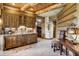 Wet bar with wooden cabinets and granite countertop at 300 Little Sallie Barber Trl, Breckenridge, CO 80424