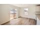 Backyard view through sliding glass door. Room has hardwood floors and base trim at 21964 E 39Th Ave, Aurora, CO 80019