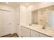 Well-lit bathroom with double sinks, stone countertops, and a large mirror at 21964 E 39Th Ave, Aurora, CO 80019