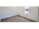 Bedroom featuring plush carpeting and a window offering natural light at 21964 E 39Th Ave, Aurora, CO 80019