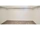 Walk-in closet featuring plush carpeting and built-in shelving for optimal storage at 21964 E 39Th Ave, Aurora, CO 80019
