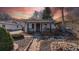 Charming bungalow with a cozy front porch, desert xeriscape and brick walkway at 437 Raleigh St, Denver, CO 80204