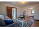 Light filled living room featuring hardwood floors, area rug and adjacent rooms at 437 Raleigh St, Denver, CO 80204