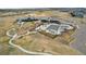 Aerial view of community with clubhouse, playground, pool, and gathering areas at 9162 Star Streak Cir, Littleton, CO 80125