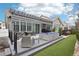 This backyard features a covered patio, exterior siding, and green space at 9162 Star Streak Cir, Littleton, CO 80125
