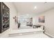 Spacious basement with bar, tv area, exercise equipment, and lounge seating at 9162 Star Streak Cir, Littleton, CO 80125