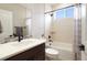 This bathroom features a shower and tub combo, natural light, and attractive hardware at 9162 Star Streak Cir, Littleton, CO 80125
