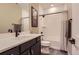 Bathroom with a shower-tub combination, black fixtures, and a modern vanity at 9162 Star Streak Cir, Littleton, CO 80125