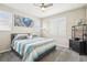 Bright bedroom featuring a ceiling fan, neutral walls, carpet flooring, and lots of natural light at 9162 Star Streak Cir, Littleton, CO 80125