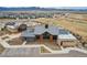 Aerial view of the clubhouse with parking, playground, and picnic shelter at 9162 Star Streak Cir, Littleton, CO 80125