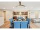 Cozy dining area leading into a well-equipped kitchen with a center island and modern finishes at 9162 Star Streak Cir, Littleton, CO 80125