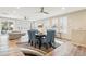 Open-concept living space featuring a dining room, fireplace, and a comfortable seating area at 9162 Star Streak Cir, Littleton, CO 80125