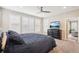 The main bedroom has a ceiling fan, natural light, and a large closet at 9162 Star Streak Cir, Littleton, CO 80125