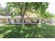 Expansive backyard showcasing a lush lawn and a covered patio perfect for outdoor living at 3901 S Dexter St, Cherry Hills Village, CO 80113