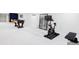 Spacious basement featuring workout space, neutral carpet, and a nearby foosball table at 3901 S Dexter St, Cherry Hills Village, CO 80113