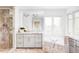 Modern bathroom with marble accents, a soaking tub, and a glass-enclosed shower at 3901 S Dexter St, Cherry Hills Village, CO 80113