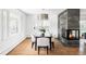 Elegant dining room with modern lighting, fireplace, and ample seating for Gathering and guests at 3901 S Dexter St, Cherry Hills Village, CO 80113