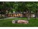 Charming home with a well-manicured front lawn and mature trees, located at 3901 S Dexter Street at 3901 S Dexter St, Cherry Hills Village, CO 80113