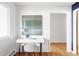 Bright minimalist office space featuring modern desk and chair, natural light and stylish artwork at 3901 S Dexter St, Cherry Hills Village, CO 80113