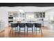 Stylish kitchen with a large island, stainless steel appliances, and an abundance of natural light at 3901 S Dexter St, Cherry Hills Village, CO 80113