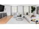 Bright living room featuring a cozy sectional sofa, a modern entertainment center, and ample natural light at 3901 S Dexter St, Cherry Hills Village, CO 80113