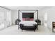 Stylish main bedroom with a four-poster bed and modern decor at 3901 S Dexter St, Cherry Hills Village, CO 80113