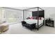 Bright main bedroom featuring a four-poster bed and outdoor access, perfect for relaxation and privacy at 3901 S Dexter St, Cherry Hills Village, CO 80113