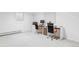 Bright office area in the basement, featuring two desks and neutral carpet at 3901 S Dexter St, Cherry Hills Village, CO 80113