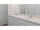 Bathroom with double vanity and tiled shower at 8317 Snake River St, Littleton, CO 80125