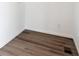 Hallway featuring light hardwood flooring, white walls, and white trim at 8317 Snake River St, Littleton, CO 80125