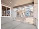 A charming porch with white railing provides serene outdoor living at 8317 Snake River St, Littleton, CO 80125