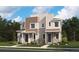 Modern two-story townhomes featuring stone accents, complementary siding, and inviting covered front entrances at 17035 E Alameda Pkwy, Aurora, CO 80017