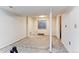 Unfinished basement with a window and a support beam, offering potential for customization at 13199 Ash St, Thornton, CO 80241